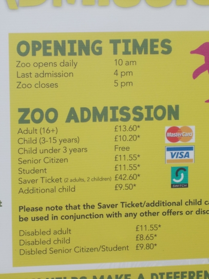 Photo of the price board outside the zoo. Adult admission shows as £13.60 and disabled child admission £8.65