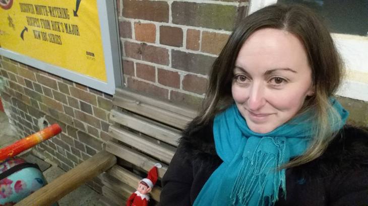 Alfie the Elf and Joanna Grace sat waiting for a train.