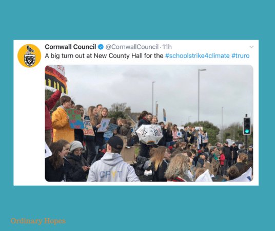 Children holding placards, demonstrating at Cornwall Council office to raise awareness of climate change. Taken from a Tweet by Cornwall Council, with the text " A big turn out at New County Hall for the #SchoolStrike4Climate #Truro